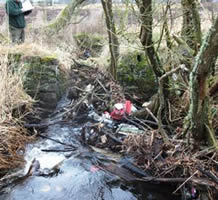 A debris blockage preventing salmonid migration